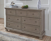 Ashley Furniture Lettner Dresser with multiple drawers and sleek wood finish, showcasing its modern storage design.