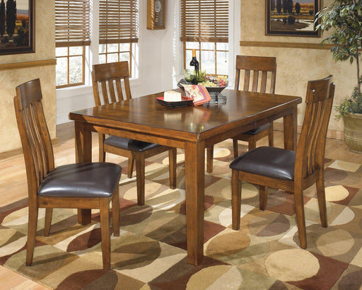 Ashley Furniture Ralene dining room set with a wooden table and matching chairs in a modern dining space.