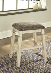 Counter height bar stool from Ashley Furniture with a wooden seat and metal frame, ideal for kitchen or bar area.