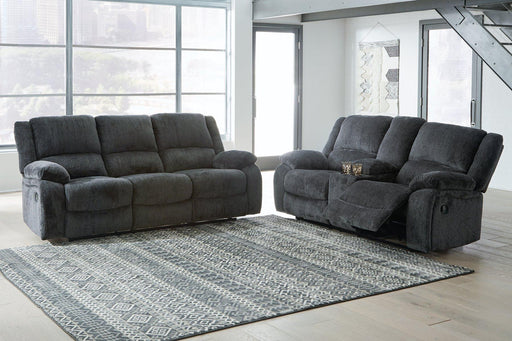 Ashley Furniture Draycoll living room set featuring a sofa and matching chairs in a modern design with neutral upholstery.