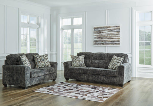 Ashley Furniture Lonoke Living Room Set with sofa and armchair in a modern, stylish living room setting
