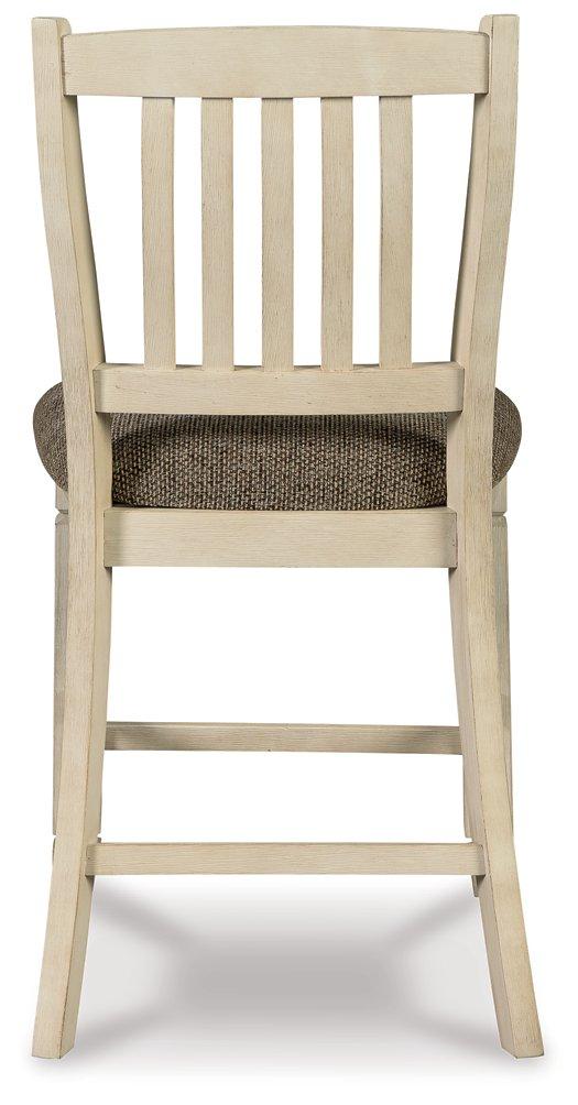 Counter height Ashley Furniture Bolanburg barstool with wood legs and cushioned seat, ideal for kitchen or bar area.