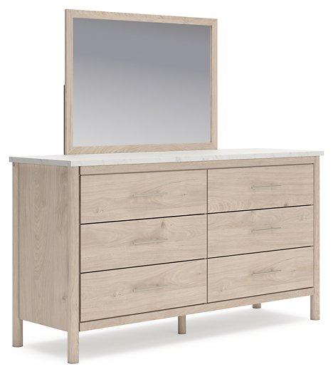 Ashley Furniture Cadmori dresser and mirror set, featuring a modern wooden dresser with an attached mirror for bedroom storage.