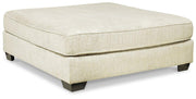 Ashley Furniture Rawcliffe Living Room Set featuring a sofa and loveseat with neutral upholstery and modern design.