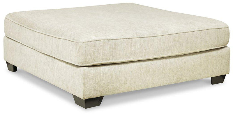 Ashley Furniture Rawcliffe Living Room Set featuring a sofa and loveseat with neutral upholstery and modern design.