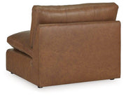 Ashley Furniture Emilia Sectional sofa with plush cushions, neutral fabric, and modern design in a spacious living room setting.