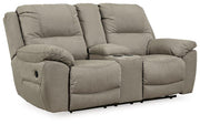 Ashley Furniture Next-Gen Gaucho reclining loveseat with built-in console, featuring plush cushions and dark upholstery.