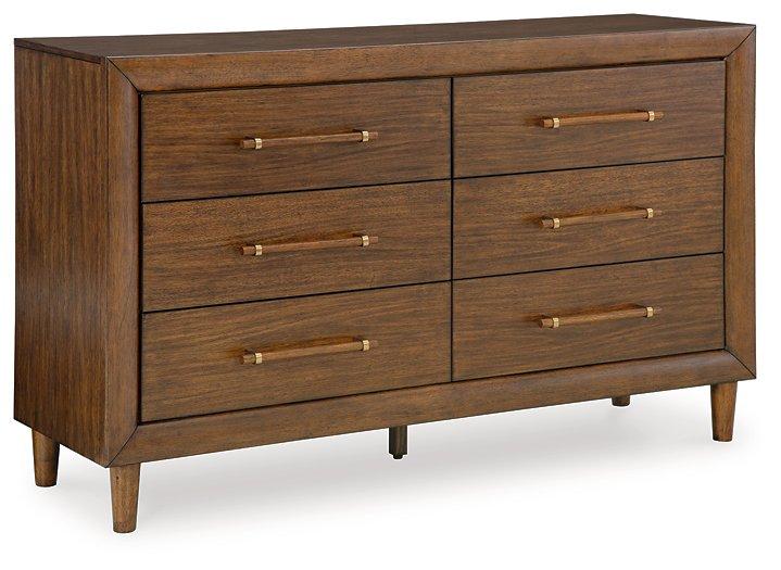 Ashley Furniture Lyncott dresser with mirror showing a modern wooden dresser with a large attached mirror and sleek hardware.
