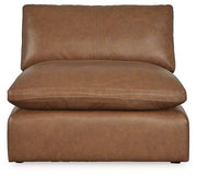 Emilia leather sectional sofa with matching ottoman by Ashley Furniture, featuring plush cushions and modern design.