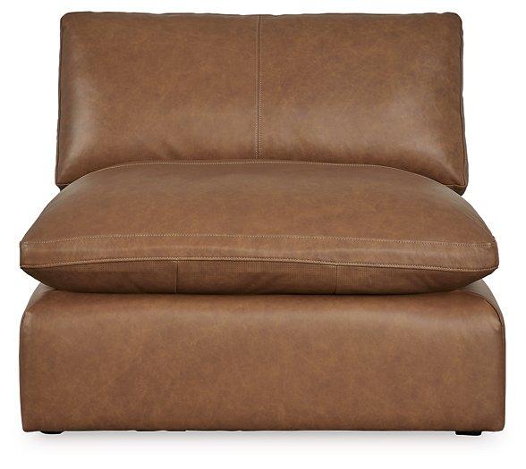 Emilia leather sectional sofa with matching ottoman by Ashley Furniture, featuring plush cushions and modern design.