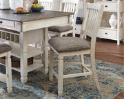 Counter height Ashley Furniture Bolanburg bar stool with wooden legs and cushioned seat, ideal for kitchen or bar area.