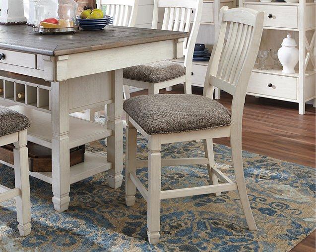 Counter height Ashley Furniture Bolanburg bar stool with wooden legs and cushioned seat, ideal for kitchen or bar area.