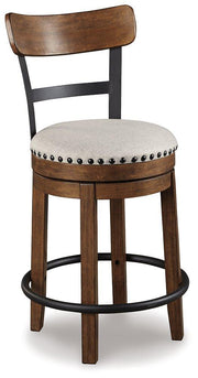 Ashley Furniture Valebeck counter height bar stool with wooden legs and upholstered seat, ideal for kitchen or bar area.