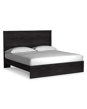 Ashley Furniture Belachime bedroom set with a bed, matching nightstands, and dresser in a modern bedroom style.