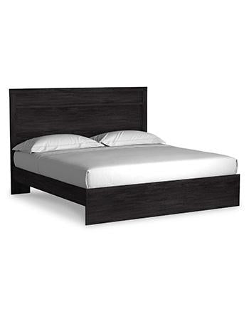 Ashley Furniture Belachime bedroom set with a bed, matching nightstands, and dresser in a modern bedroom style.