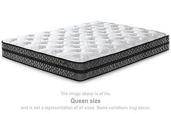 10-inch Ashley Furniture hybrid mattress with pocketed coils and plush fabric cover, shown in a bedroom setting.