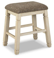 Ashley Furniture Bolanburg counter height bar stool with wooden legs and cushioned seat for modern kitchen or bar area.