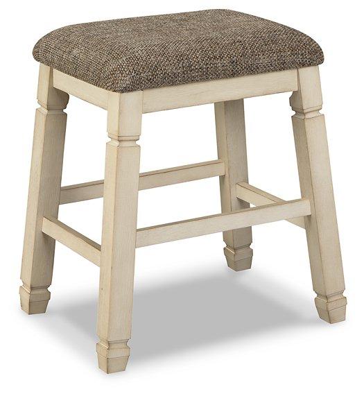 Ashley Furniture Bolanburg counter height bar stool with wooden legs and cushioned seat for modern kitchen or bar area.