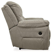 Next-Gen Gaucho Reclining Loveseat with Console by Ashley Furniture, showing plush gray fabric, built-in armrest console, and reclining features.