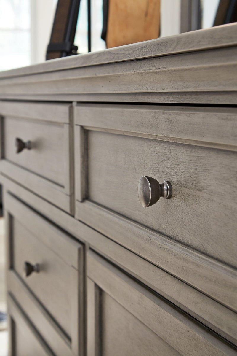 Lettner dresser by Ashley Furniture featuring a modern wooden design with multiple drawers for bedroom storage