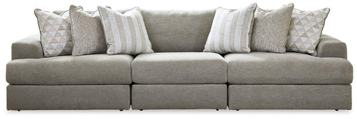Ashley Furniture Avaliyah sectional sofa with plush cushions and modern design, shown in a spacious living room setting.