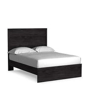 Ashley Furniture Belachime bedroom set featuring a bed with a headboard, matching nightstands, and a dresser in a modern bedroom scene