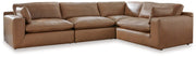 Comfortable Ashley Furniture Emilia Sectional sofa with plush cushions and neutral fabric, shown in a modern living room setting.