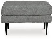 Ashley Hazela living room set with a sofa and loveseat, featuring neutral upholstery and modern design in a stylish living space.