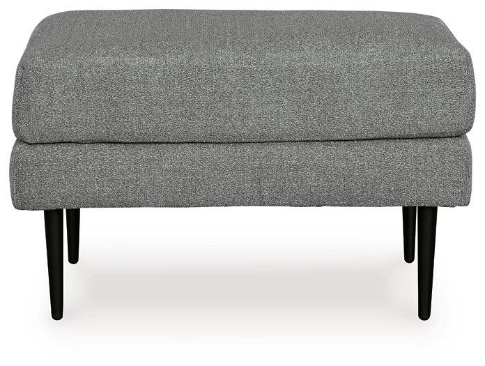 Ashley Hazela living room set with a sofa and loveseat, featuring neutral upholstery and modern design in a stylish living space.