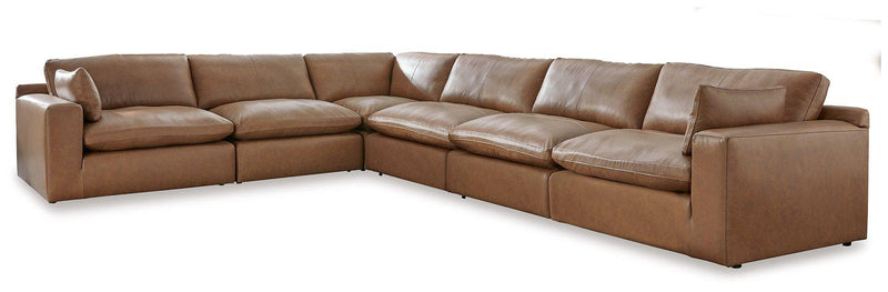 Ashley Furniture Emilia Sectional in neutral fabric, featuring plush cushions and modern design for stylish living room seating.
