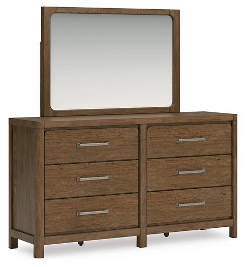 Ashley Furniture Cabalynn dresser with attached mirror, featuring a modern wood finish and sleek hardware.