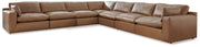 Ashley Furniture Emilia Sectional sofa with plush cushions and modern design in a neutral fabric, shown in a living room setting.
