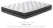 10-inch Ashley Furniture hybrid mattress with pocketed coil system, showing plush surface and supportive layers for comfortable sleep.