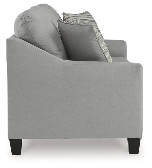Ashley Furniture Adlai Sleeper Sofa showing a modern, upholstered sofa bed with clean lines and plush cushions in a living room setting.