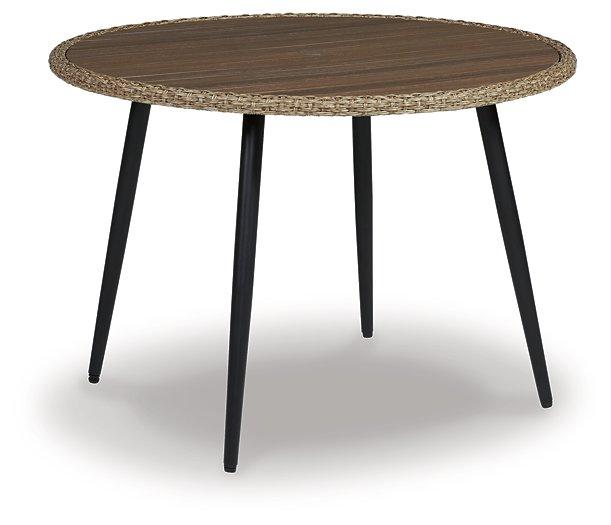 Outdoor dining table from Ashley Furniture with a wooden finish, ideal for patio or garden outdoor dining spaces.