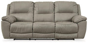 Next-Gen Gaucho reclining sofa by Ashley Furniture, featuring plush upholstery, wide armrests, and modern design.