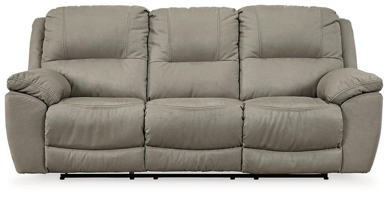 Next-Gen Gaucho reclining sofa by Ashley Furniture, featuring plush upholstery, wide armrests, and modern design.