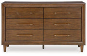 Ashley Furniture Lyncott dresser with attached mirror, featuring modern wood finish and sleek drawer handles.