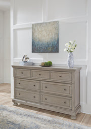 Ashley Furniture Lettner Dresser with multiple drawers and sleek wood finish, designed for modern bedroom storage.
