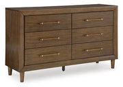Ashley Furniture Lyncott dresser and mirror set with a sleek wood finish and modern design, featuring multiple drawers and a matching mirror.