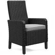 Set of two Ashley Furniture Beachcroft outdoor dining arm chairs with cushions, featuring stylish weather-resistant design.