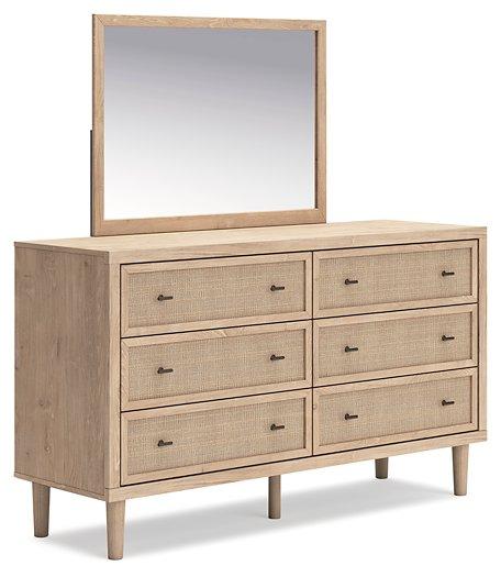 Ashley Furniture Cielden dresser with mirror, featuring a modern wooden design and sleek hardware in a bedroom setting