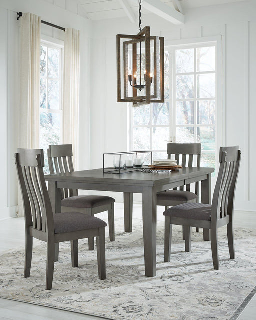 Ashley Furniture Hallanden dining room set with a rectangular table and six matching upholstered chairs, ideal for family dining.
