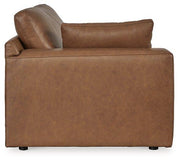Ashley Furniture Emilia Sectional sofa with plush cushions and modern design, shown in a cozy living room setting.