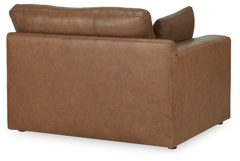 Comfortable Ashley Emilia Sectional sofa with plush cushions and neutral fabric, perfect for modern living rooms.
