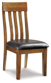 Ashley Furniture Ralene dining room set featuring a wooden table and matching chairs in a modern, elegant design.