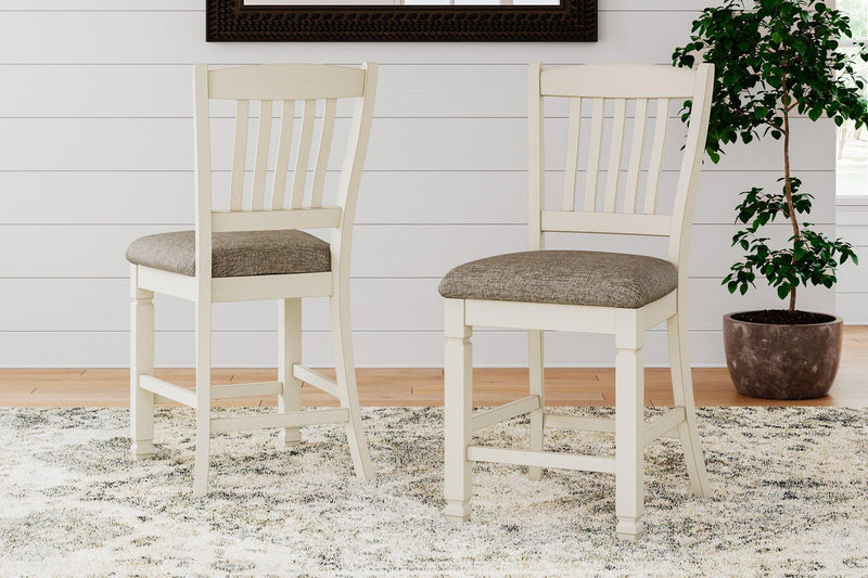 Ashley Furniture Bolanburg counter height bar stool with wooden legs and cushioned seat, ideal for kitchen or bar area.