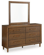 Ashley Furniture Lyncott dresser and mirror set with wooden finish, featuring multiple drawers and a matching mirror for bedroom decor.