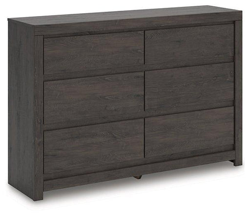Ashley Furniture Fraluna dresser with multiple drawers and a modern dark wood finish, showcasing sleek design and sturdy construction.
