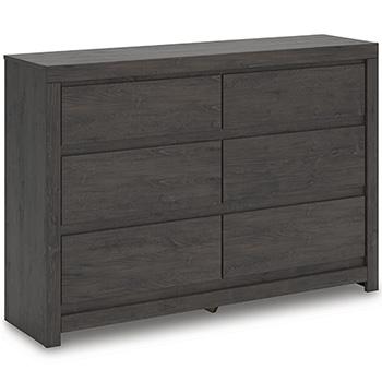 Ashley Furniture Fraluna Dresser with multiple drawers and modern wood finish, displayed in a contemporary bedroom setting.